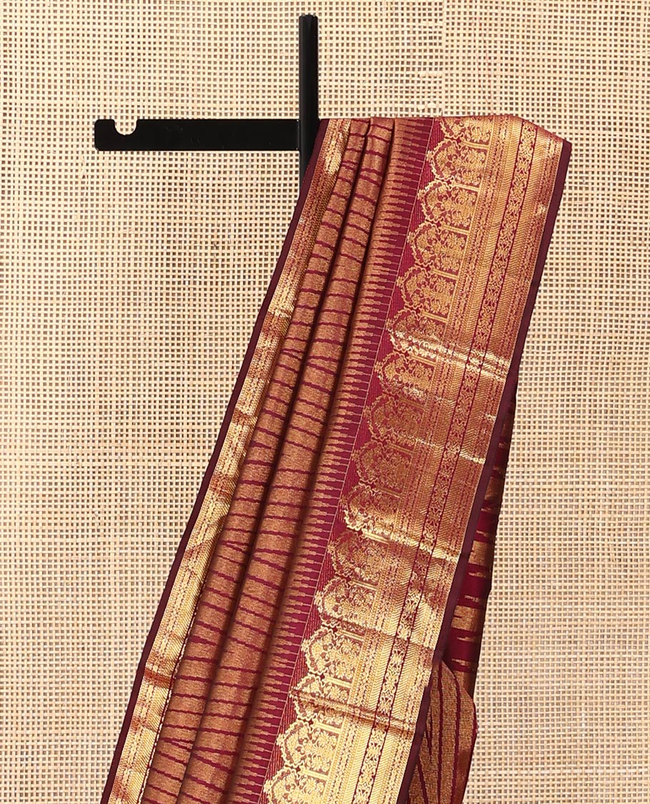 Maroon temple jacquard Kanchipuram designer saree, rekku border of floral bouquet, and traditional designs, and thazampoo rekku pallu