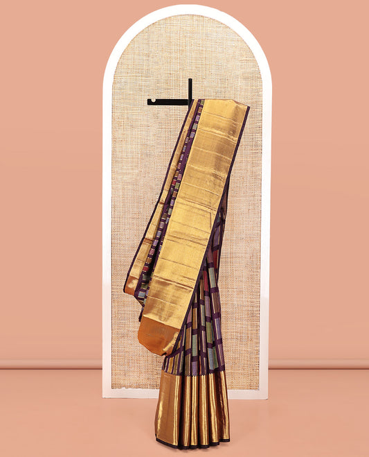 Purple Kanchipuram Designer Silk Saree, Adorned with Kaleidoscope-colored Meenakari-style Blocks On Its Body, Highlighted by Gleaming Thick Zari Temple Border, Scintillating Zari Decked Up Pallu and Paired with a Matching Blouse