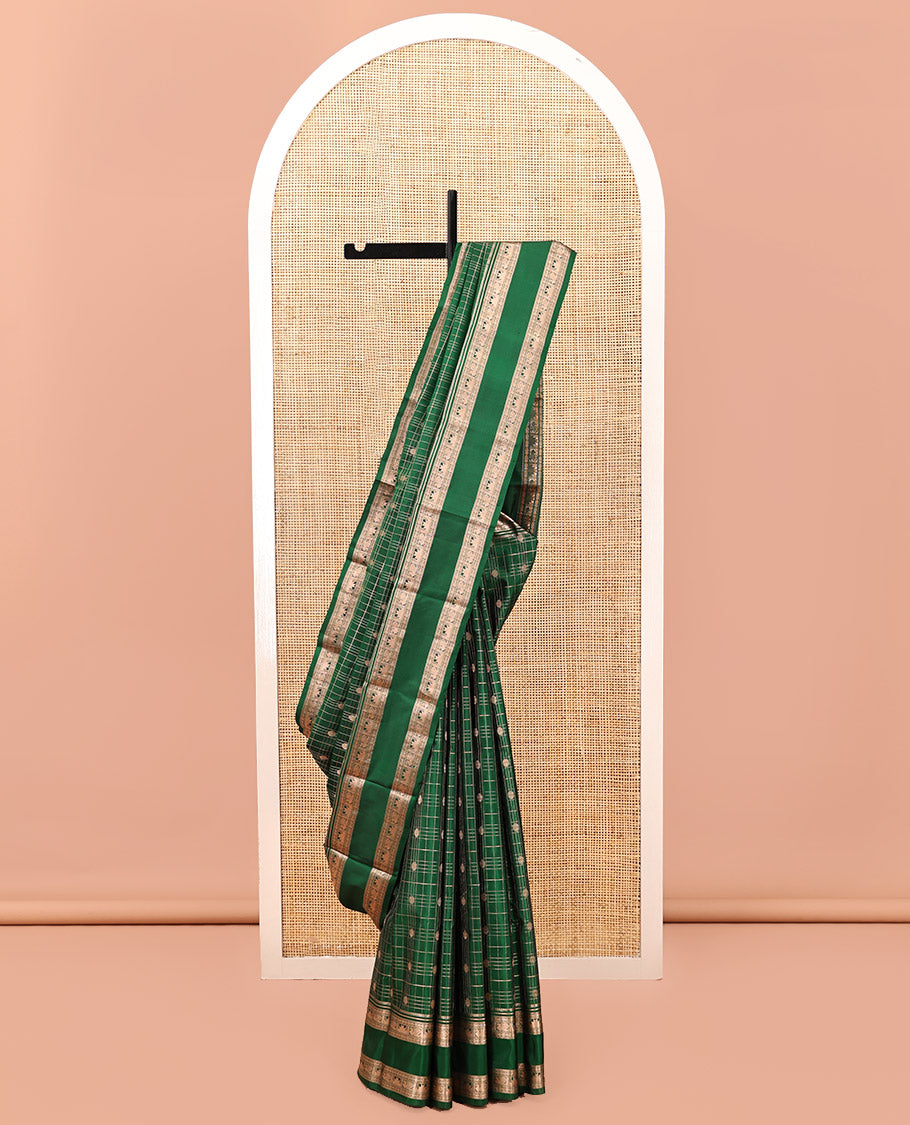 Green Kanchipuram Silk Saree, Detailed with Buttas and Checks, a Zari Rettai Pettu Border of Thazampoo Rekku, and Mayil Designs, Grand Pallu, and a Matching Blouse