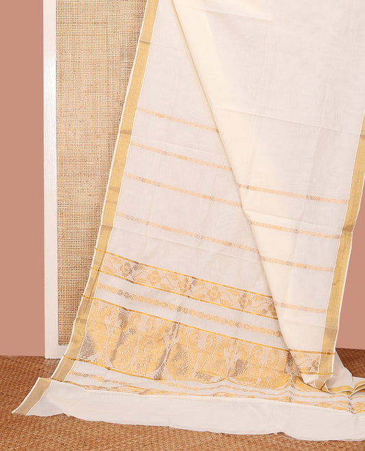 Cream Kerala Saree, Accentuated with Zari Stripes on its Body, Subtly Sparkled Bavanji Border, Gleaming Zari Woven Pallu of Floral, and Peacock Designs, and Paired with a Matching Blouse