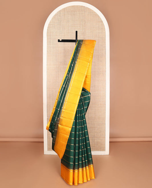 Green buttas enclosed checked soft silk saree, contrast rettai pettu border & pallu of butta enclosed checks