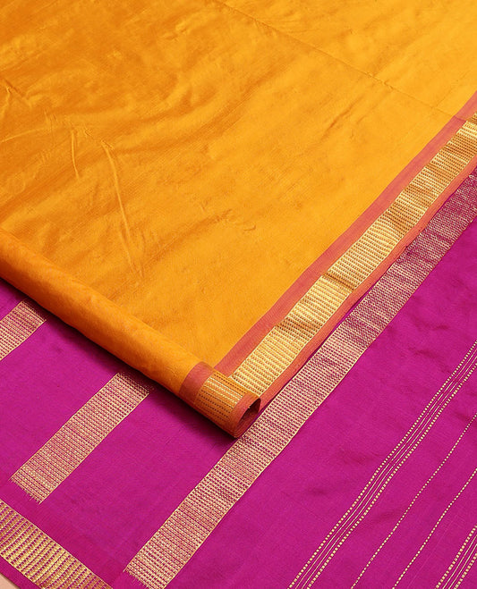 Mango yellow plain nine-yard silk saree, contrast border of Muthu designs, and pallu of zari designs