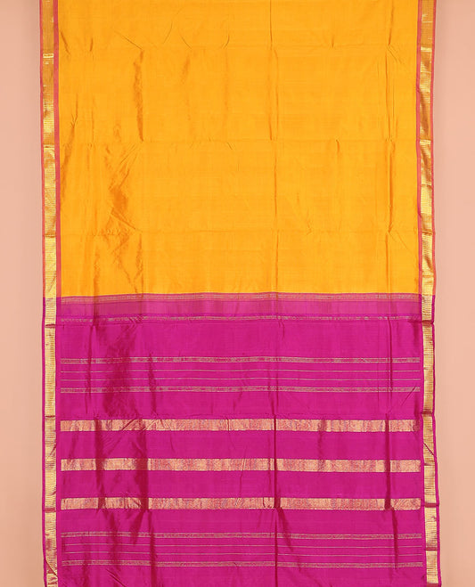 Mango yellow plain nine-yard silk saree, contrast border of Muthu designs, and pallu of zari designs