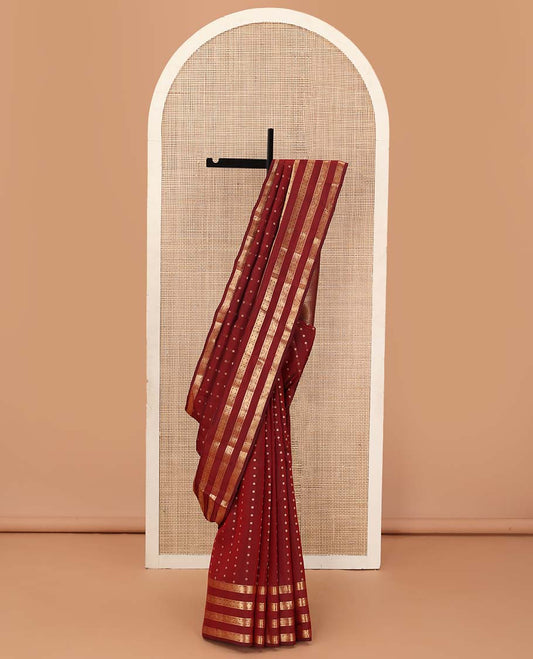 Red zari buttas Vasundhara silk mix saree, zari border of kuthirai, mayil, yaanai, neli, muthu, paisa, and kodi manga designs, and geometric pallu