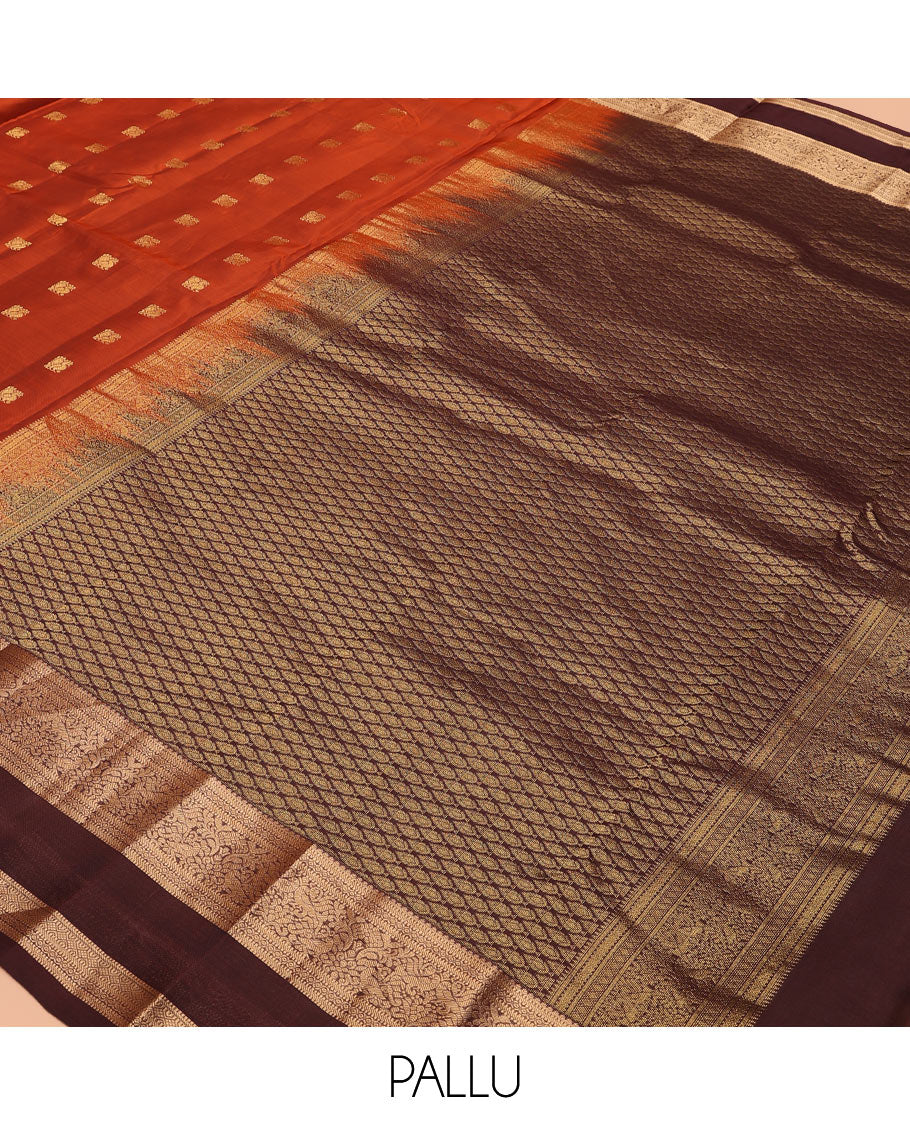 Rust Orange Vasundhara Lite-Silk Mix Saree Showcasing Mayil Buttas, Complemented with a Contrast Rettai Pettu Border Featuring Muthu, Diamond, and Mayil Designs, Adorned with Jaal Pallu, and a Contrast Blouse