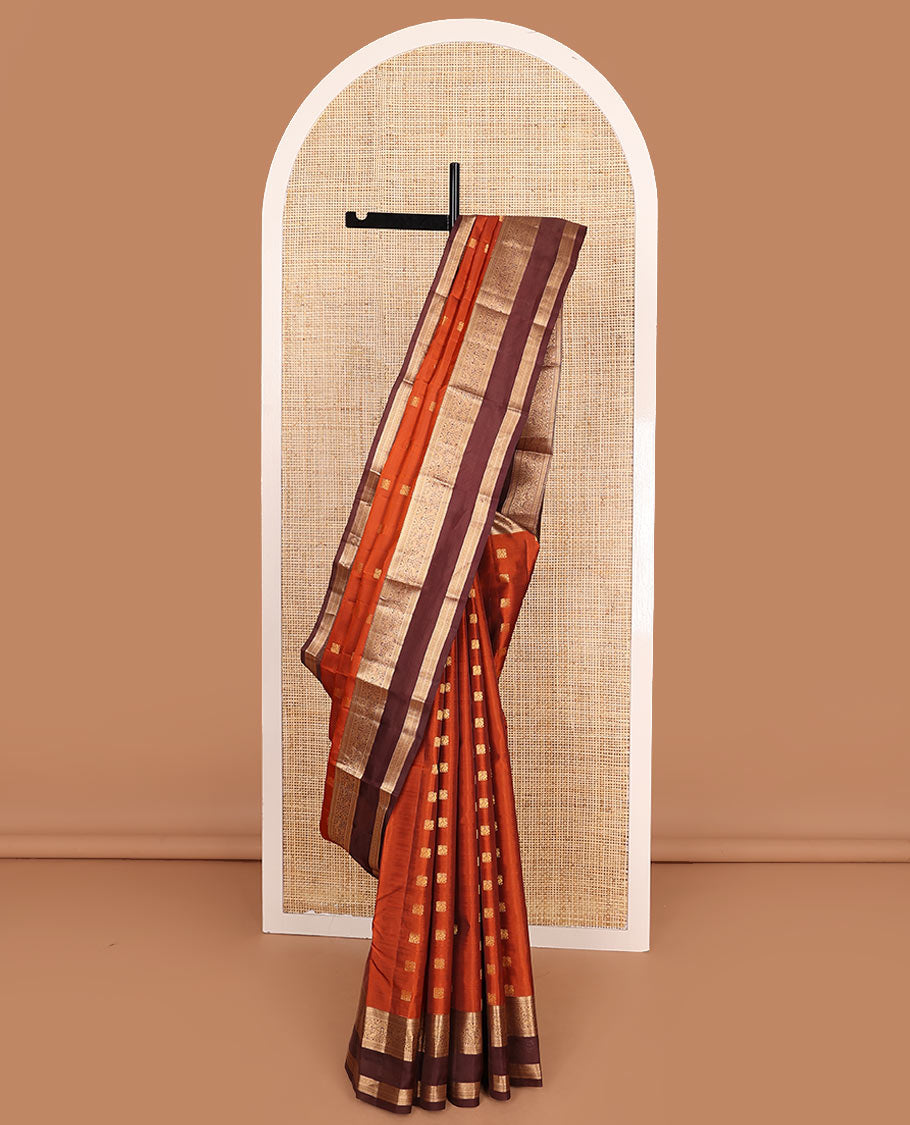 Rust Orange Vasundhara Lite-Silk Mix Saree Showcasing Mayil Buttas, Complemented with a Contrast Rettai Pettu Border Featuring Muthu, Diamond, and Mayil Designs, Adorned with Jaal Pallu, and a Contrast Blouse