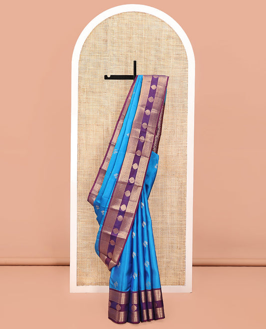 Blue Vasundhara Lite Silk Mix Saree, Elevated with Zari Buttas All Over Its Body, Complemented by a Contrast Border of Rekku, Diamond, Cross Kamalam and Zari Designs, Grand Floral Design Pallu, and Paired with a Contrast Blouse