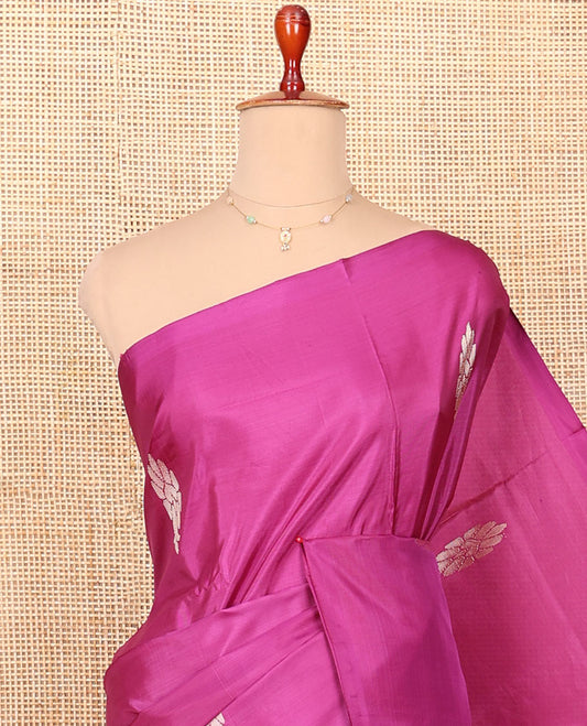 Borderless Magenta Banana Pith Saree Highlighted with Zari Buttas, Complemented by a Contrasting Pallu Steeped with Stripes and Buttas, and Paired with a Contrast Plain Blouse