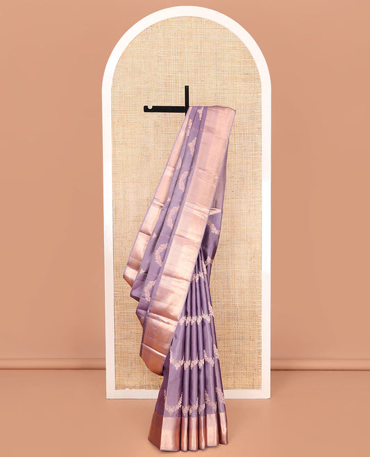 Lavender Vasundhara Silk Saree, Embellished with Floral Jaal Jacquard on Its Body, Highlighted by a Zari Border of Thilakam Mokku, Lavangam, and Jaal Designs, Grandly Woven Jaal Pallu, and Paired with a Matching Blouse