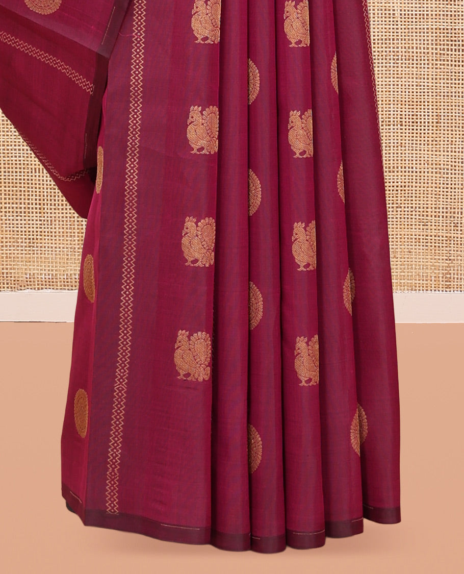 Borderless Purple Vasundhara Silk Saree, Artfully Detailed with Mayil and Chakram Buttas, Grandly Woven Pallu, and a Matching Blouse