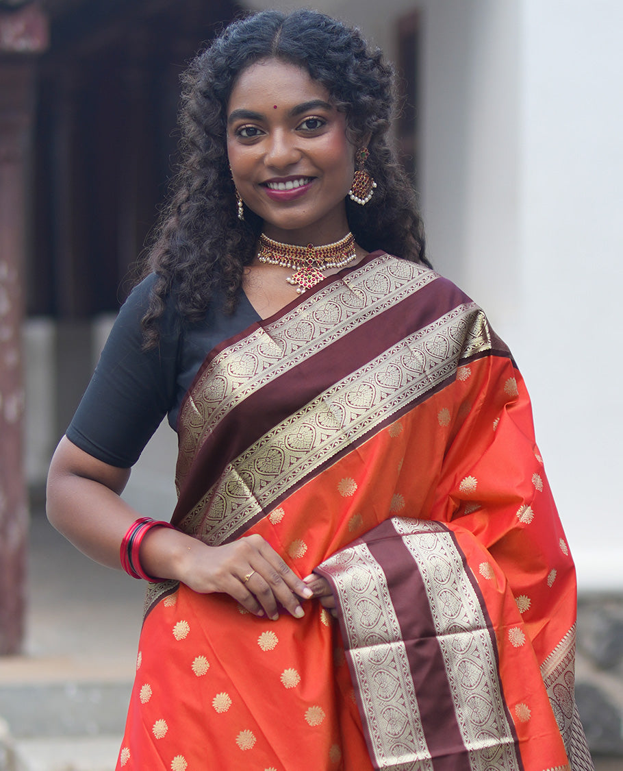 Orange-Brown Budget Silk Saree Features Zari Buttas, Complemented by Contrast Rettai Pettu Traditional Zari Border, Paisleys Pallu, and a Contrast Blouse