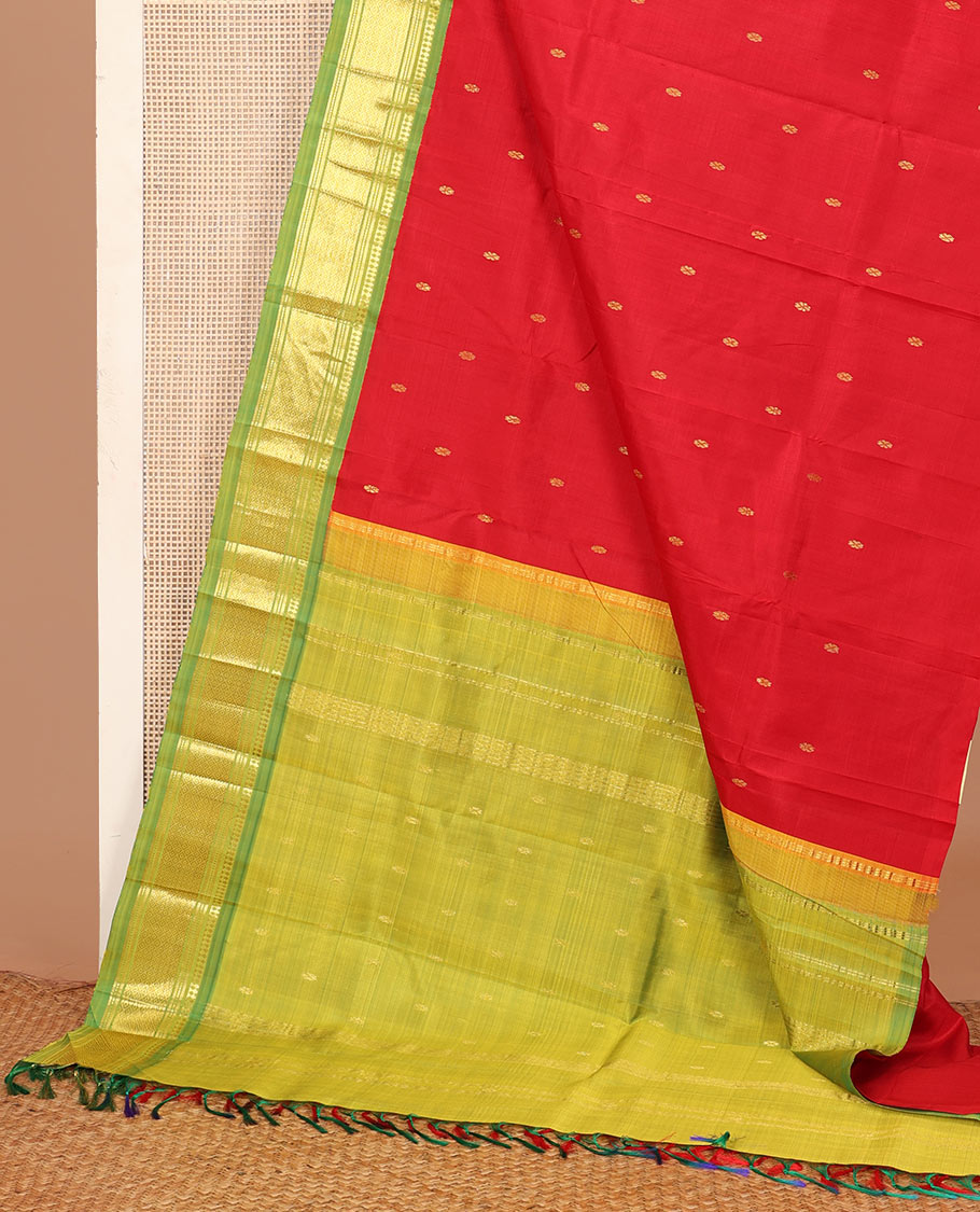 Red zari buttas Kanchipuram silk saree, contrast one-sided korvai border of panner sombu, muthu, banaras, and mayil kann, and zari design pallu