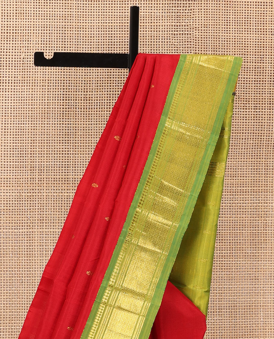 Red zari buttas Kanchipuram silk saree, contrast one-sided korvai border of panner sombu, muthu, banaras, and mayil kann, and zari design pallu