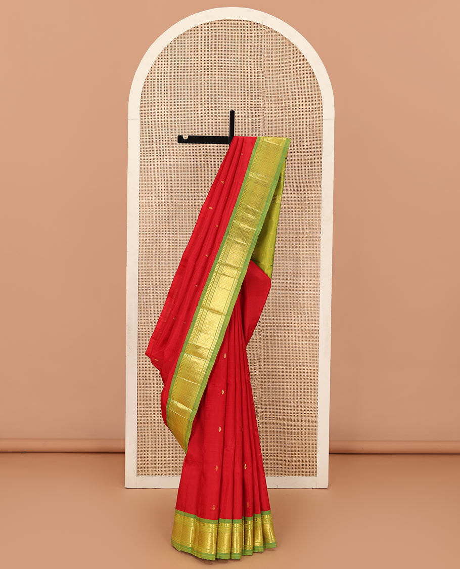 Red zari buttas Kanchipuram silk saree, contrast one-sided korvai border of panner sombu, muthu, banaras, and mayil kann, and zari design pallu