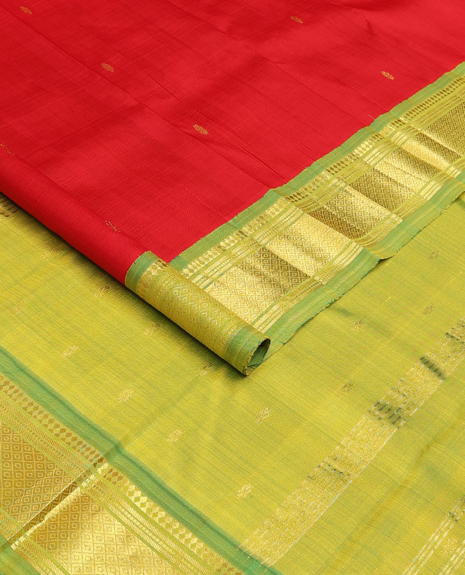 Red zari buttas Kanchipuram silk saree, contrast one-sided korvai border of panner sombu, muthu, banaras, and mayil kann, and zari design pallu
