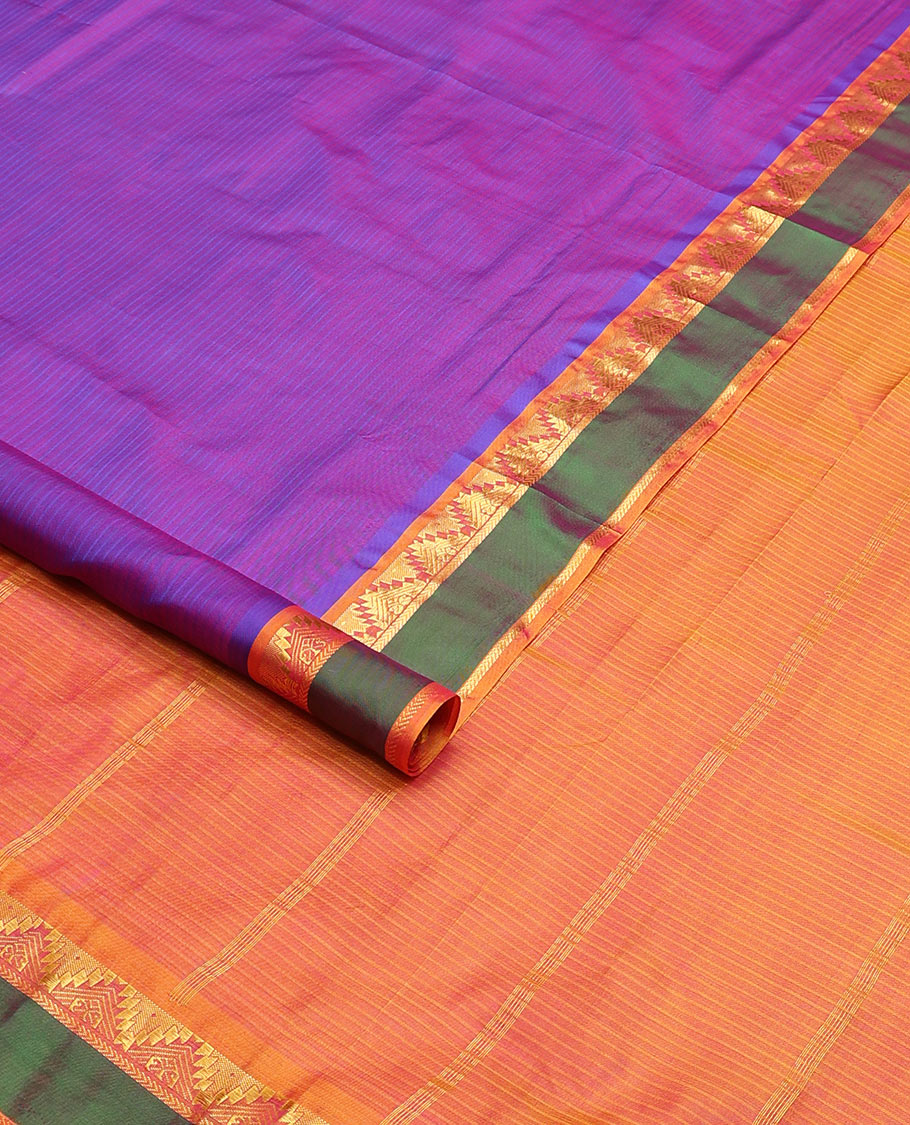 Violet striped nine-yard silk saree, contrast rettai pettu border of thazampoo rekku and kathir designs, and zari striped pallu