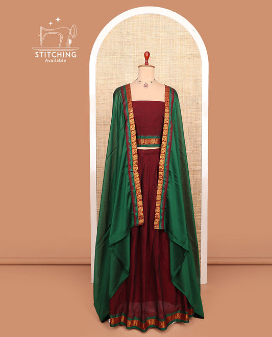 Maroon plain cotton half-saree with peacock bordered skirt, matching blouse, and a contrast peacock bordered dhavani
