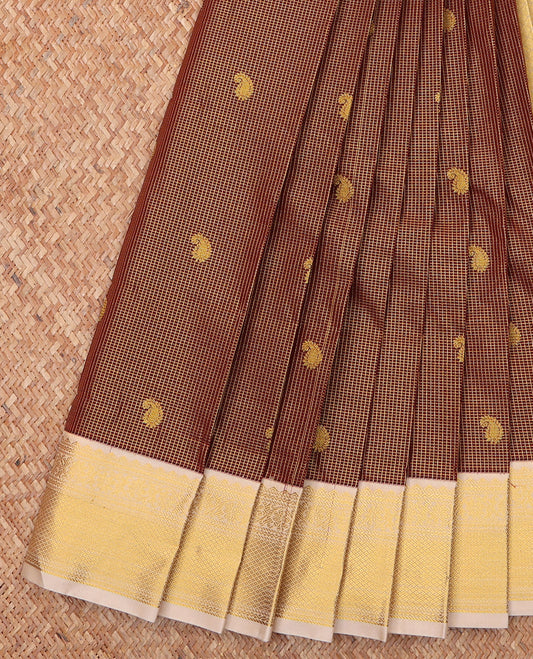 Brown Budget Silk Saree, Prettified with Zari Butta Enclosed Checks On Its Body, Complemented by Contrast Traditional Zari Designs Woven Border, Gleaming Zari Pallu and Paired with a Contrast Blouse