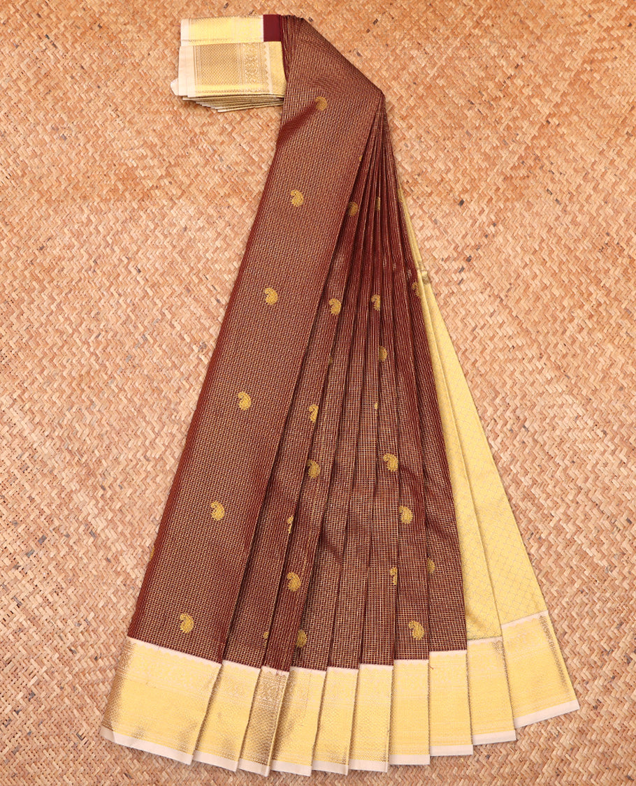 Brown Budget Silk Saree, Prettified with Zari Butta Enclosed Checks On Its Body, Complemented by Contrast Traditional Zari Designs Woven Border, Gleaming Zari Pallu and Paired with a Contrast Blouse
