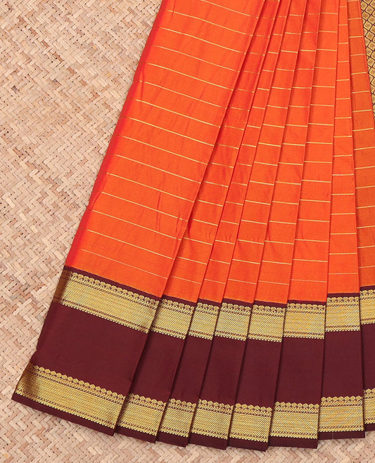 Orange Budget Silk Saree, Boldly Accentuated with Zari Stripes on Its Body, Complemented by a Contrast Traditional Zari Design Woven Rettai Pettu Border, Gleaming Jaal-Patterned Pallu, and Paired with a Contrast Blouse