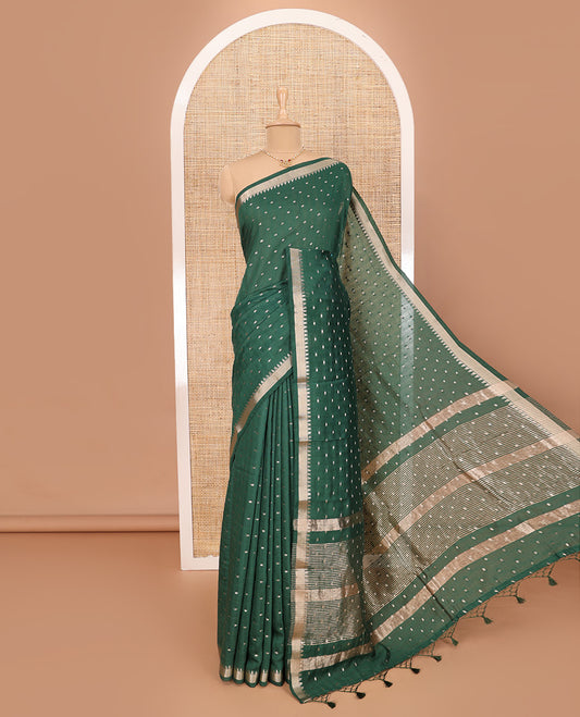 Green Assam Silk Saree Features Bright Zari Buttas All Over Its Body, a Subtle Temple Zari Border, a Pallu Highlighted with Zari Stripes, and Comes with a Matching Blouse