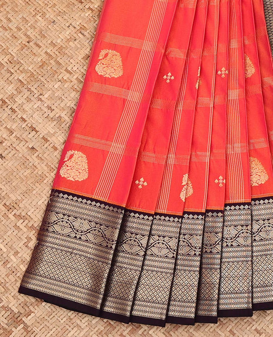 Orange Budget Silk Saree, Masterfully Woven with Zari Butta Enclosed Checks on Its Body, Complemented by a Contrast Traditional Zari Border, a Grand Jaal Pallu, and Paired with a Contrast Blouse