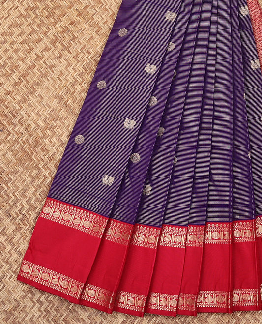 Violet Budget Silk Saree, Ornamented with Zari Stripes and Peacock-Chakram Buttas All Over Its Body, Complemented by a Contrast Traditional Zari Design Rettai Pettu Border, Majestically Detailed Pallu, and Paired with a Contrast Blouse