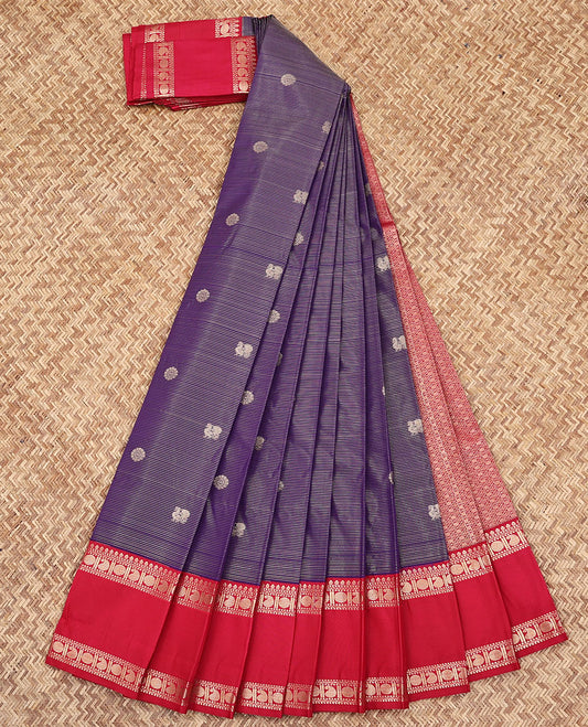 Violet Budget Silk Saree, Ornamented with Zari Stripes and Peacock-Chakram Buttas All Over Its Body, Complemented by a Contrast Traditional Zari Design Rettai Pettu Border, Majestically Detailed Pallu, and Paired with a Contrast Blouse