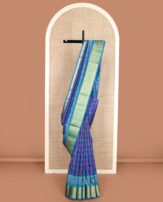 Blue triangle ikkat-stytle weave semi-banaras patola silk saree, contrast temple border, and pallu of floral and geometric motifs