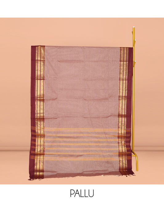 Pale Brown Plain Chettinad Cotton Saree, Complemented by Contrast Traditional Zari Design Kal Eragina Border of Paisleys, Striped Pallu, and Paired with Matching Blouse