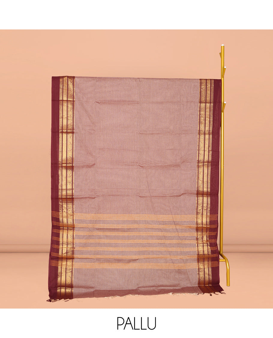 Pale Brown Plain Chettinad Cotton Saree, Complemented by Contrast Traditional Zari Design Kal Eragina Border of Paisleys, Striped Pallu, and Paired with Matching Blouse