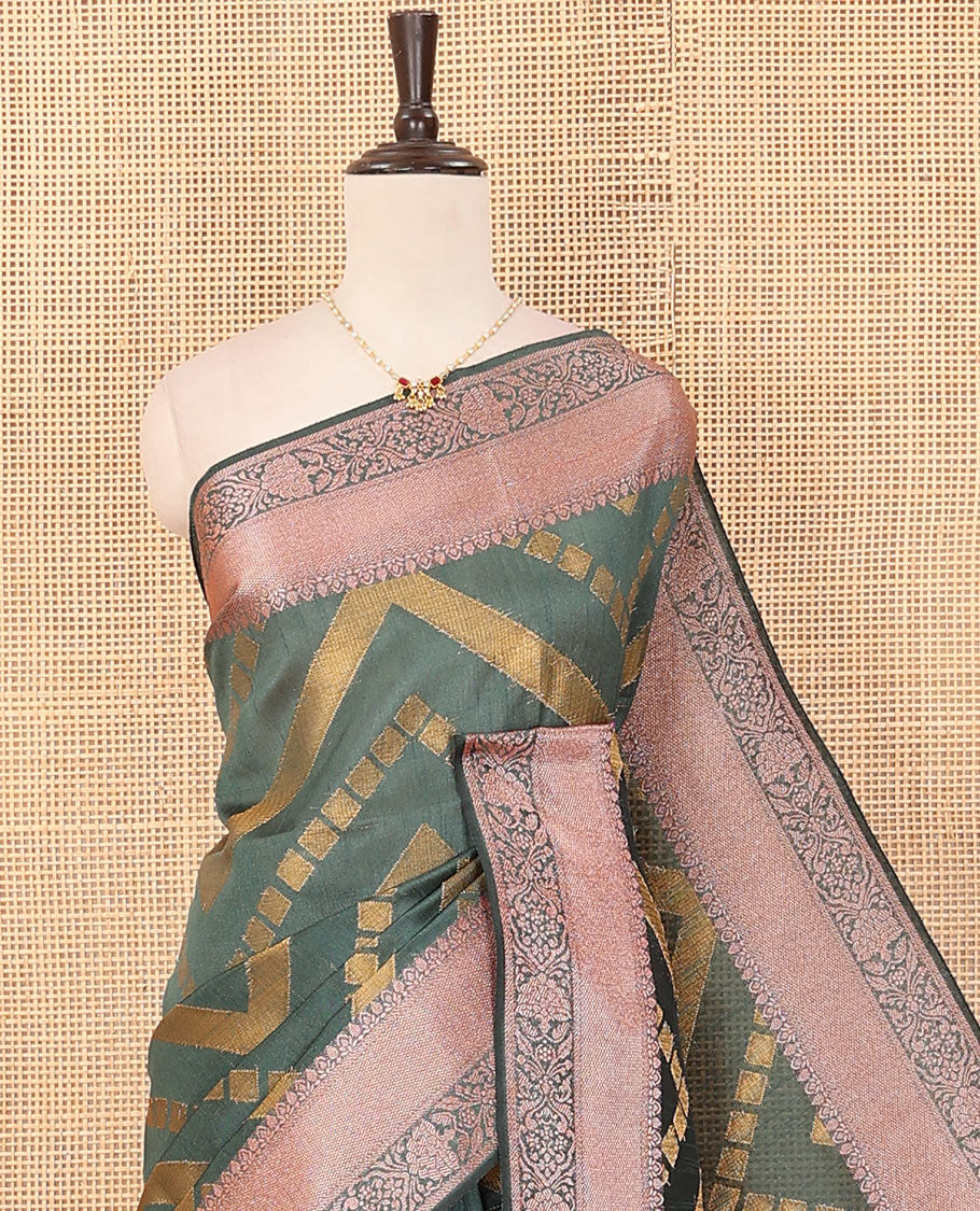 Green chevron striped dupion saree, intricate floral design border, and colorful thread striped pallu
