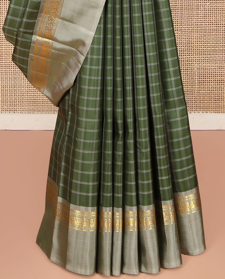 Olive Kanchipuram Silk Saree, Enthralled with Medium-Sized Checked Design All Over Its Body, Complemented by a Contrast Kal Eragina Border of Thilakam Mokku, Banaras, Muthu, and Mayil Designs, Subtly Striped Pallu, and Paired with a Contrast Blouse