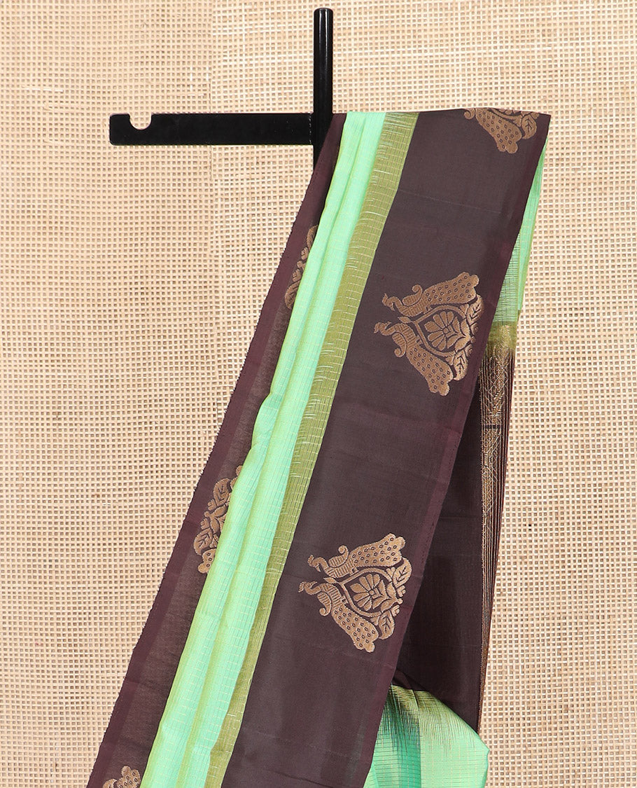 Turquoise Kanchipuram Silk Saree, Subtly Sparkled with Zari Checks on Its Body, Complemented by a Contrast Border of Mayil Designs, Pallu Beautified with Jaal Design, and Paired with a Contrast Blouse
