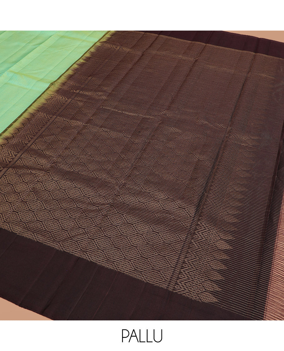Turquoise Kanchipuram Silk Saree, Subtly Sparkled with Zari Checks on Its Body, Complemented by a Contrast Border of Mayil Designs, Pallu Beautified with Jaal Design, and Paired with a Contrast Blouse