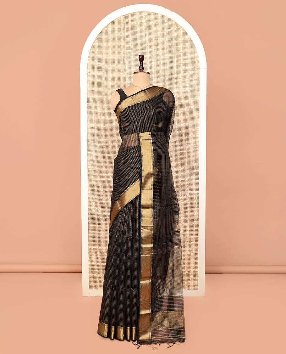 Black Maheshwari Cotton Saree, Gleamed Up with Micro-Checked Design All Over Its Body, Highlighted by Traditional Zari Border, Pallu Steeped with Zari Stripes, and Paired with a Matching Blouse