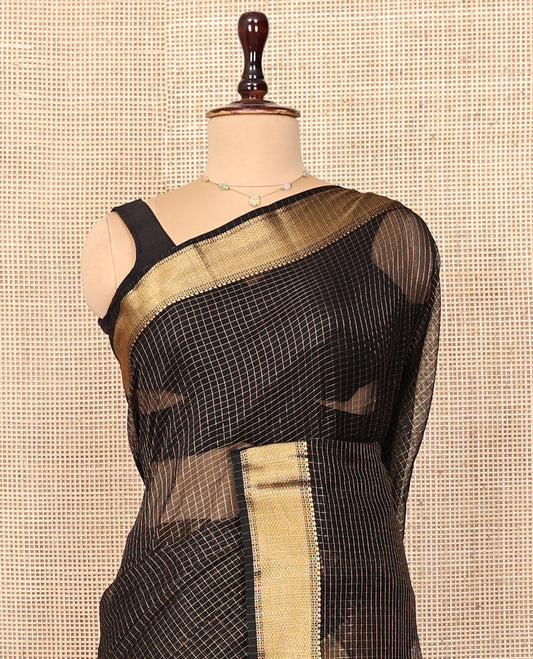 Black Maheshwari Cotton Saree, Gleamed Up with Micro-Checked Design All Over Its Body, Highlighted by Traditional Zari Border, Pallu Steeped with Zari Stripes, and Paired with a Matching Blouse