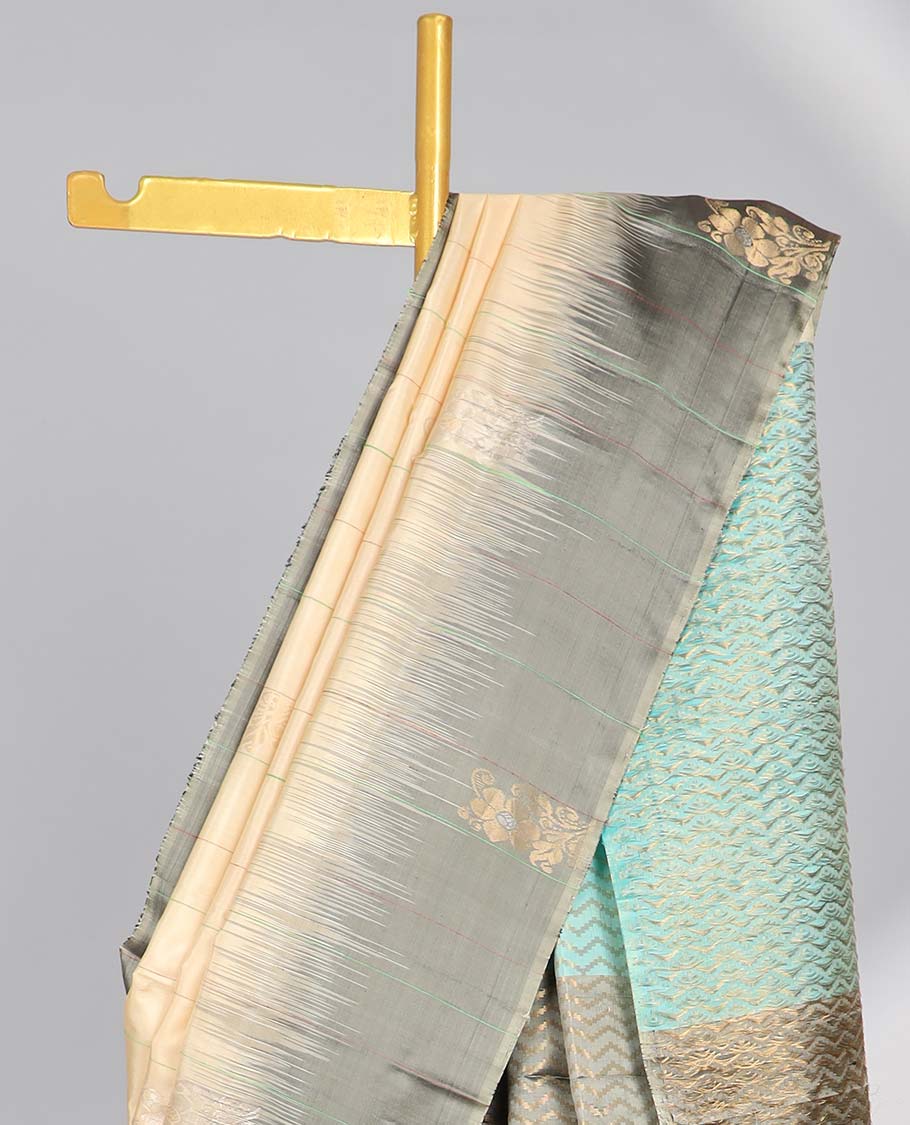 Cream floral buttas soft silk saree with contrast floral border & zig zag striped zari design pallu