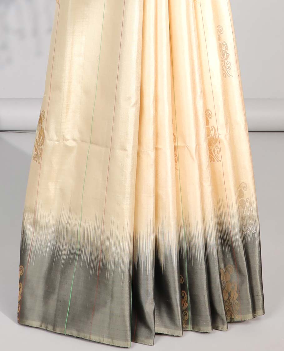 Cream floral buttas soft silk saree with contrast floral border & zig zag striped zari design pallu