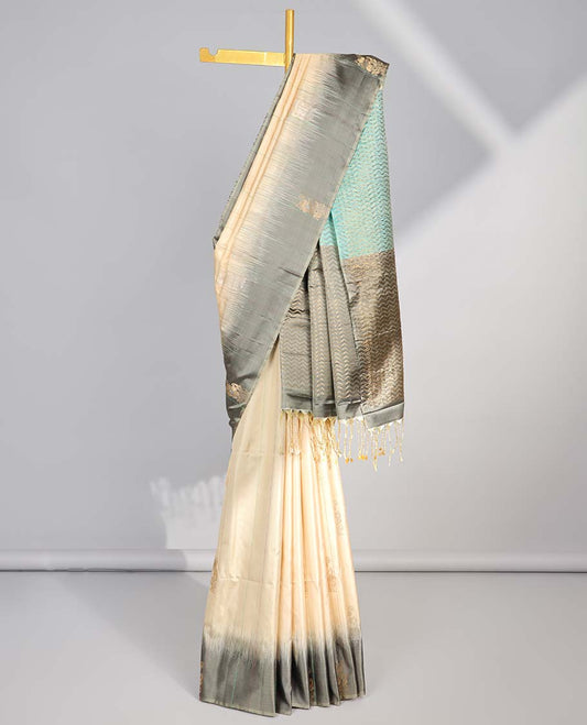 Cream floral buttas soft silk saree with contrast floral border & zig zag striped zari design pallu
