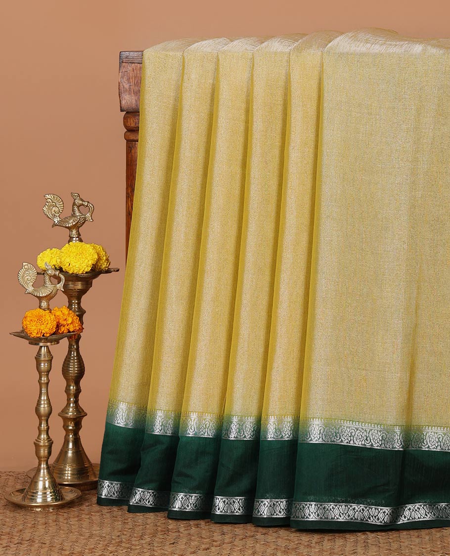 Lemon yellow plain design Tissue silk saree, contrast traditional zari border of bentex design & lined pallu with tassels