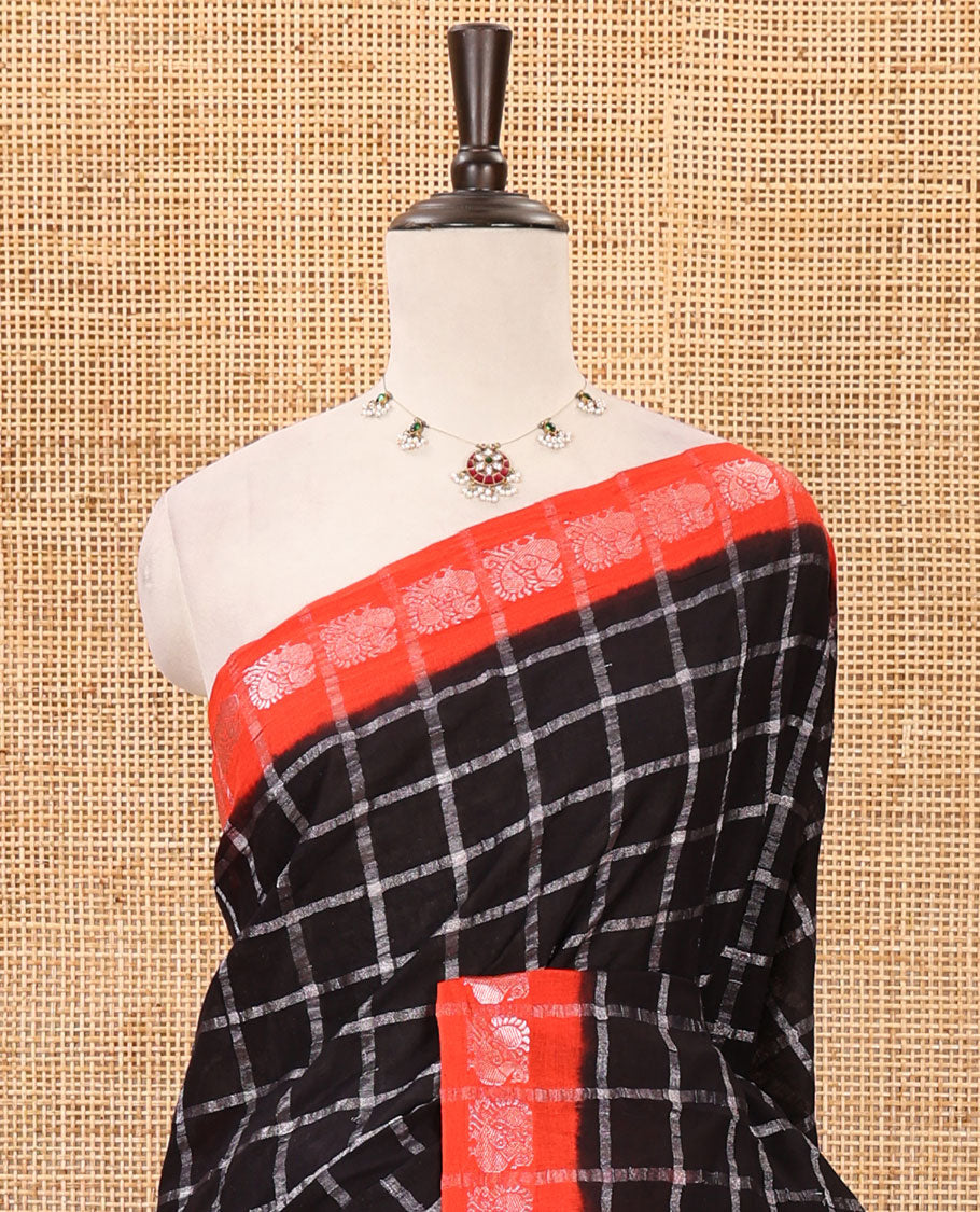 Brown zari checked sungudi cotton saree, contrast orange border of zari peacock motifs & checked peacock motif orange blouse