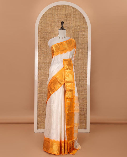 White checked semi-tafeta saree, contrast temple zari elephant motifs orange color border, zari-rich pallu & contrast checked zari border blouse