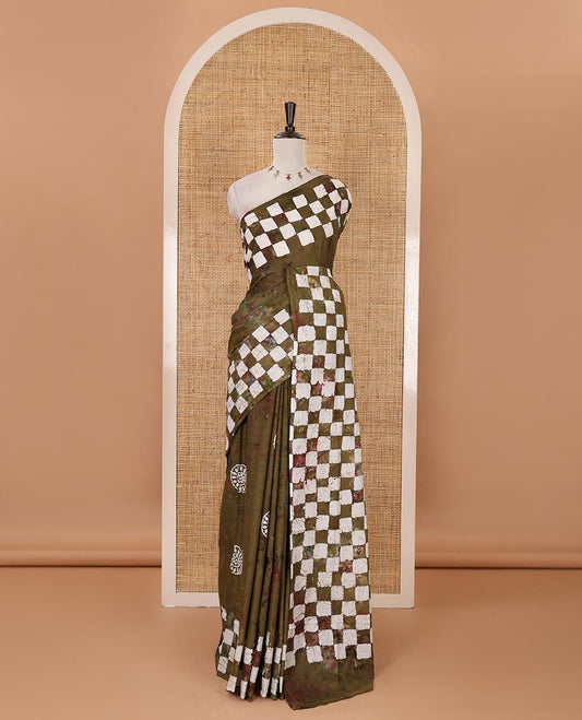 Olive green shibori dyed & batik printed mul-mul cotton saree, pasapali-checked batik printed border & pallu, & matching shibori & batik print blouse