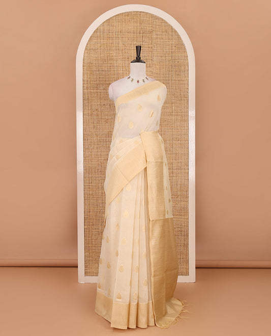 Cream gold zari thilakam motifs woven Tissue chanderi saree, gold zari bavanji border, plain pallu & brocade blouse