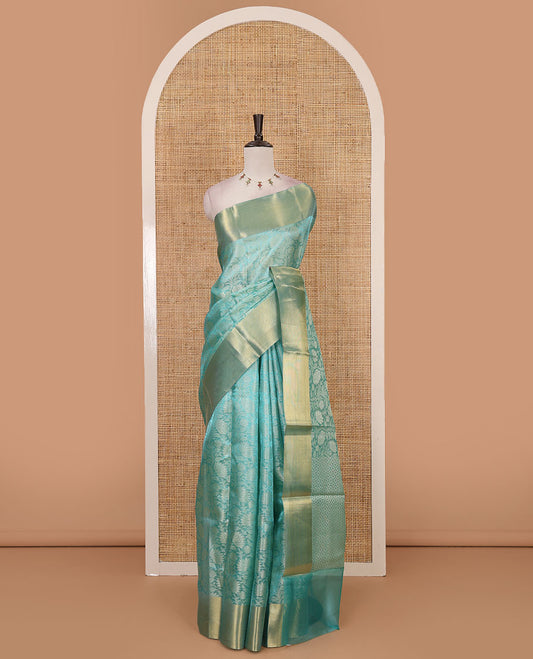 Sea green floral jaal design tissue saree, bavanji golden zari border, plain pallu & matching zari border blouse
