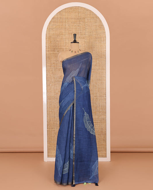 Indigo big feather motifs printed linen cotton saree, piping border, feather motifs printed pallu, and a contrast feather motifs printed blouse