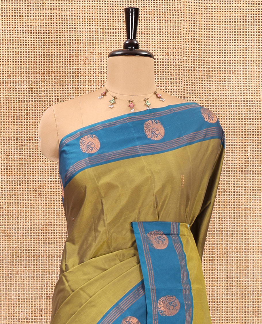 Mehendi zari buttas semi-soft silk saree, contrast peacock zari buttas and striped border, striped pallu, and a plain blouse