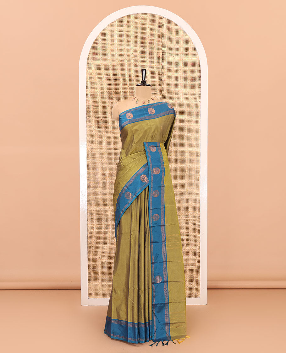 Mehendi zari buttas semi-soft silk saree, contrast peacock zari buttas and striped border, striped pallu, and a plain blouse