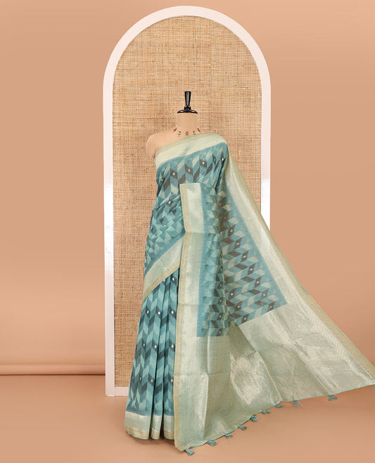 Rama zig-zag style ikkat design with buttas Munga cotton saree, zari jacquard blouse, ogee patterned pallu, and a contrast border of thread and zari buttas